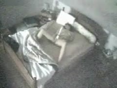 A camera concealed in the bedroom captured a lovely wife engaging in masturbation.